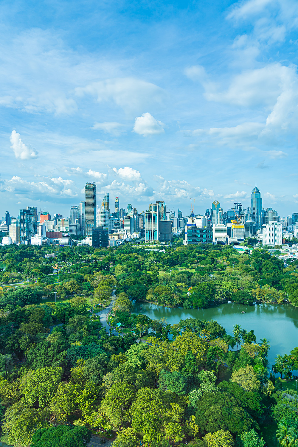 Beautiful landscape of cityscape with city building around lumpini park in bangkok